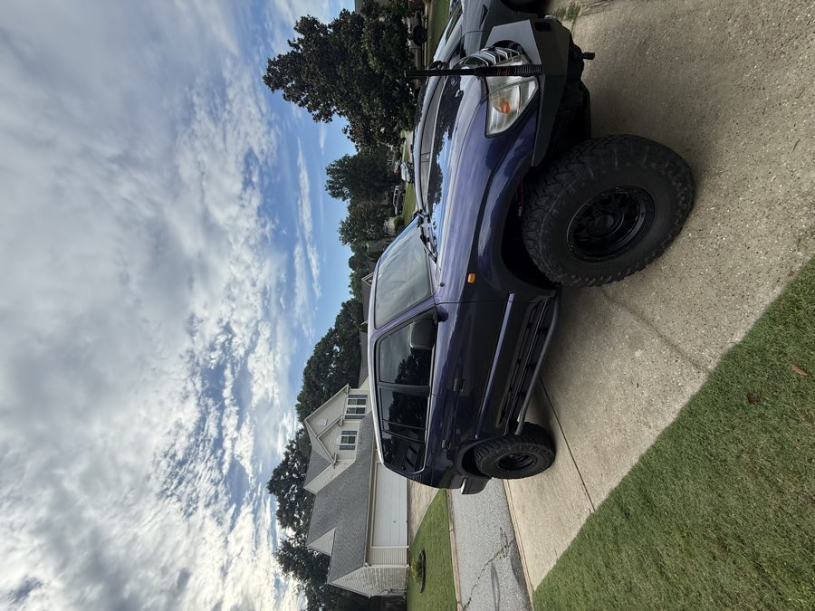 Professional window tinting on a vehicle — Simpsonville SC auto tint shop