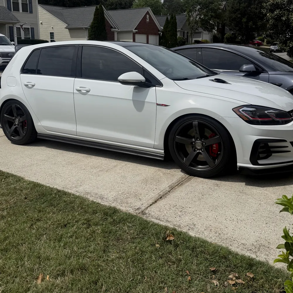 White Volkswagen GTI with dark window tint, tinted for a Greer customer