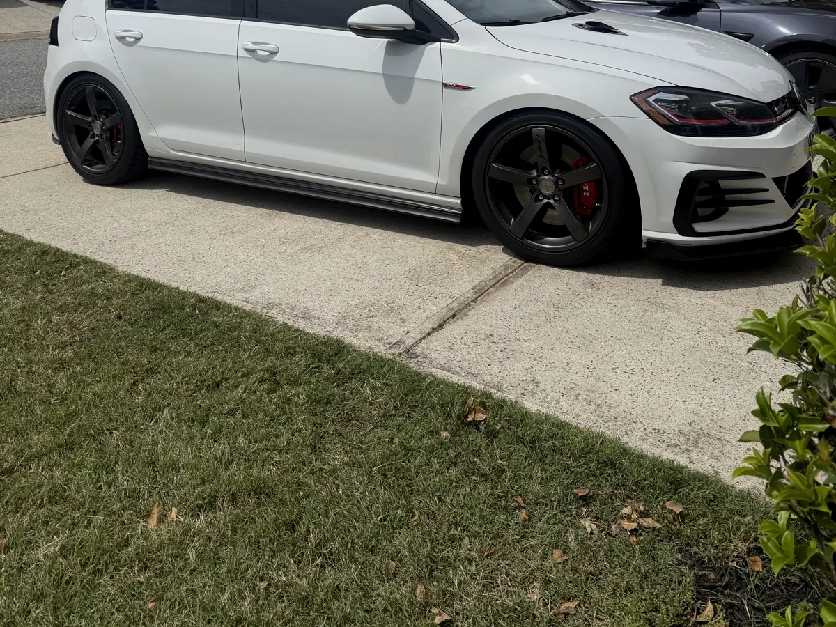 White Volkswagen GTI with dark window tint by Torque N Tint Co.