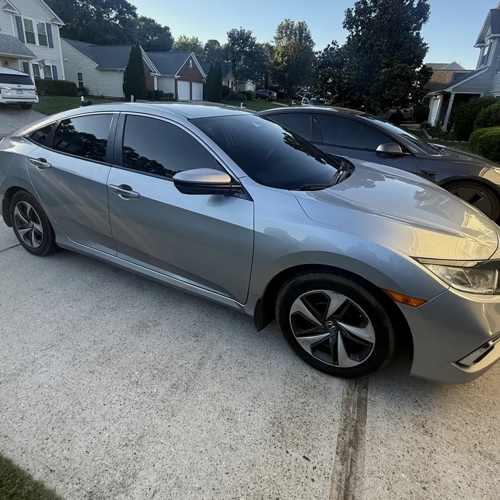Silver Honda Civic with freshly tinted windows, tinted for a Fountain Inn customer