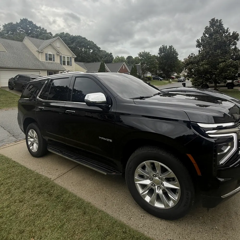 Black Chevrolet Tahoe with privacy tint, tinted for a Spartanburg customer