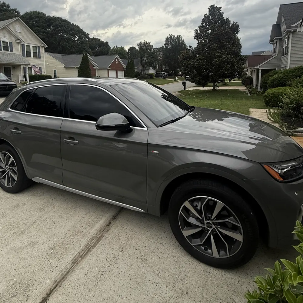 Green Audi Q5 with ceramic tint on the side and rear glass, tinted for an Easley customer