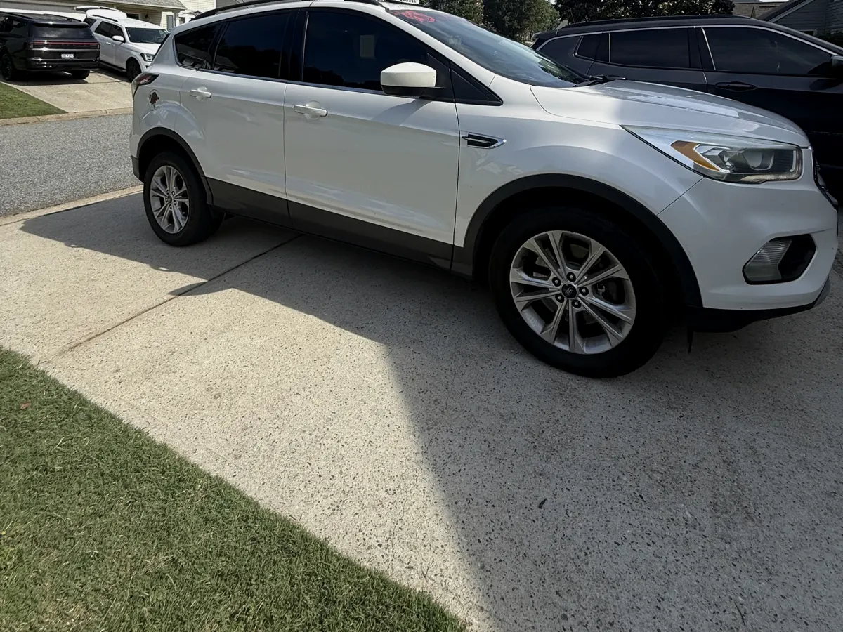 White SUV with tinted windows, Five Forks SC